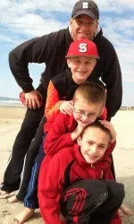 Coach Doeren with his three sons.