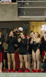 The team cheering on the sidelines at the Nike Cup Invitational