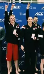 The 200 free relay team tops the podium at the ACC Championship