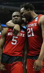 Desmond Lee and BeeJay Anya celebrate during NC State's win over No. 1 seed Villanova.