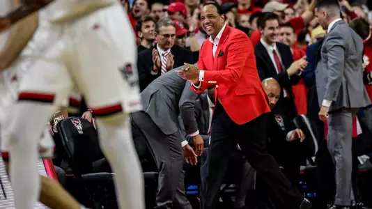 Kevin Keatts clapping red coat
