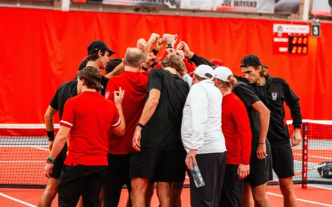 Men's tennis team huddle
