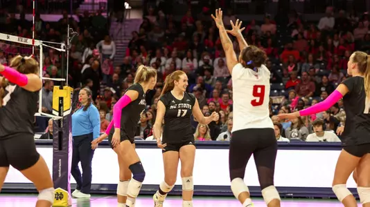 Wolfpack celebrating after a point in set one at Notre Dame 10/18/24