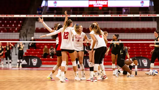 Huddle celebration in set one vs Wake Forest