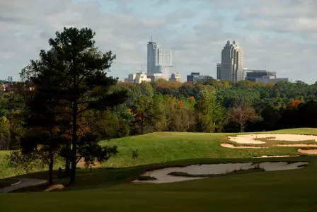 Raleigh skyline rises from behind hole 11 green of the Lonnie Poole Golf Course on Centennial Campus. PHOTO BY ROGER WINSTEAD