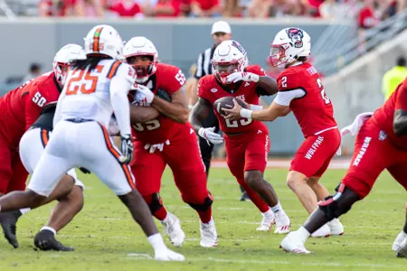 Photos from the second half of the non-conference football game between the Coastal Athletic Association (CAA) Campbell Fighting Camels and the Atlantic Coast Conference (ACC) NC State Wolfpack on October 4th, 2025 at Carter-Finley Stadium in Raleigh, NC. The Wolfpack defeated the Fighting Camels 56:10.