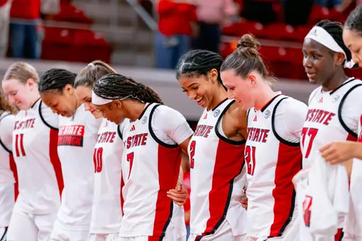 team celebrates an exhibition win