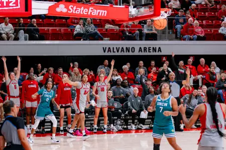 Bench cheers for Kamora Pruitt's 3-pointer