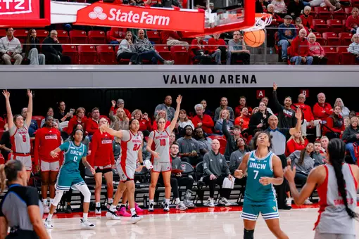 Bench cheers for Kamora Pruitt's 3-pointer