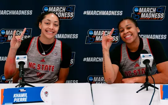 Zoe Brooks and Khamil Pierre pose at NCAA media availability