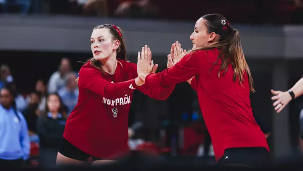 Rebecca Ring and Clara Vondran high-fiving during warm ups prior to UNC match 9/25/26