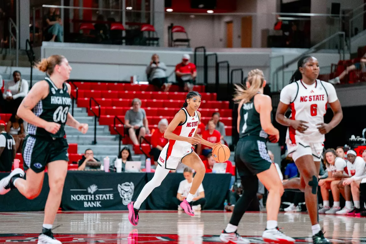 Qadence Samuels dribbles the ball up the court in NC State's exhibition game vs. High Point
