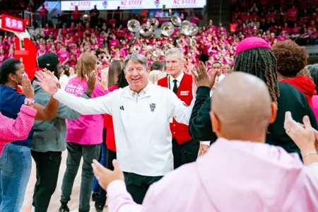 Wes Moore receives high fives from NC State women's basketball alumnae before the 2026 Play4Kay Game vs. North Carolina