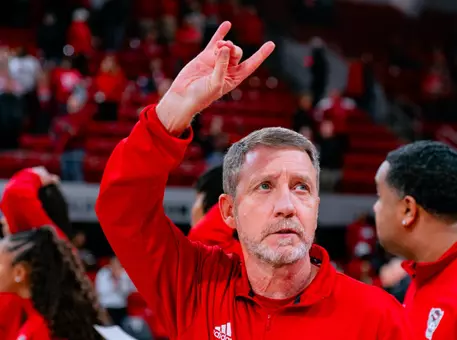 Assistant Coach Houston Fancher acknowledges the crowd after NC State defeated Clemson on Dec. 29, 2024