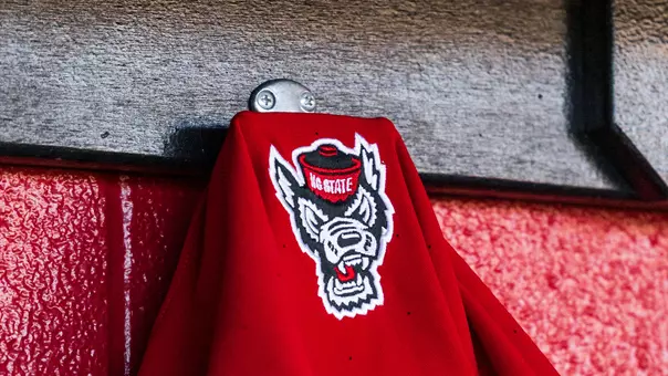 Softball jersey hanging in the dugout during the UNC Series in April 2026