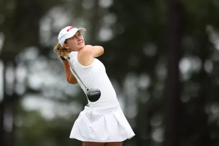 Marie Eline Madsen swings at the Cougar Classic