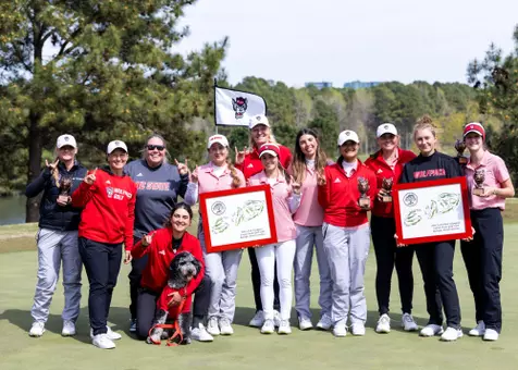 NC State women's golf team poses after a win