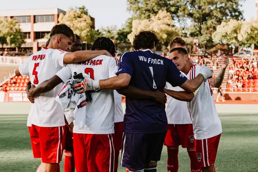 Group huddle vs. UNCW (Sept. 15, 2026)
