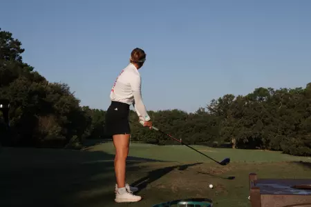 Marie Madsen tees off at the Cougar Classic