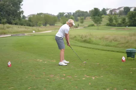 Head coach Pam Borton lines up a shot.
