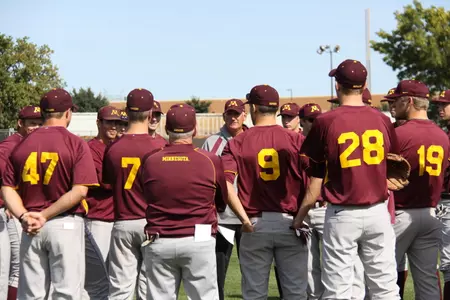 Coach Anderson addresses the team as the Gophers get ready for fall practice.