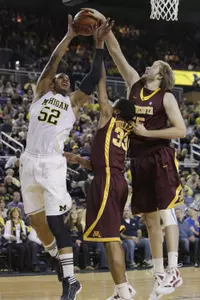 Minnesota center Elliott Eliason blocks a shot.