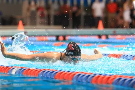 Becca Weiland won the 50 fly with a flip turn at the Water Carnival.