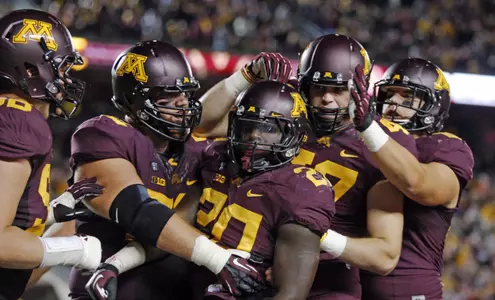 Donnell Kirkwood is congratulated by teammates after scoring a touchdown earlier this year.