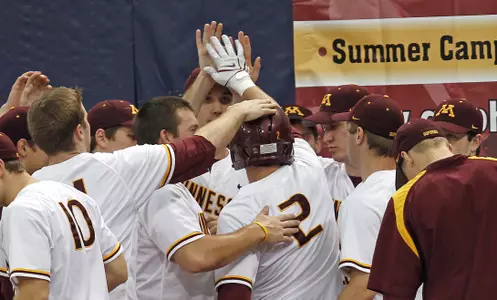 David Bettenburg after he touches home plate for his team-high 12th run scored