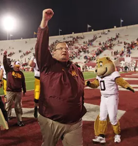 Tracy Claeys sings the Rouser with Minnesota fans after the Gophers' win at Indiana.