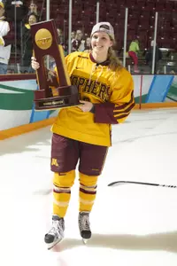 Amanda Kessel holds the 2013 NCAA national championship trophy.