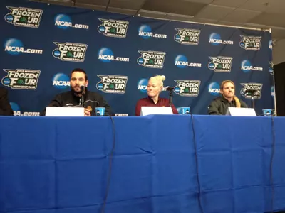 Minnesota head coach Brad Frost addresses the media