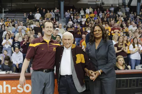 Coach Mike Burns presented Wolfenson with a new varsity letterman jacket during Minnesota's final home meet of the 2011 season.