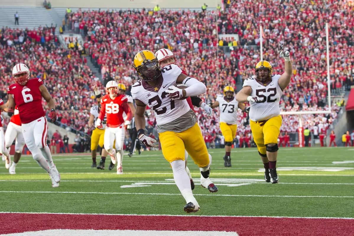 David Cobb eclipsed Laurence Maroney's school record for rushing yards in a season.