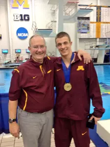 Big Ten Champion Derek Toomey with Head Men's Coach Dennis Dale