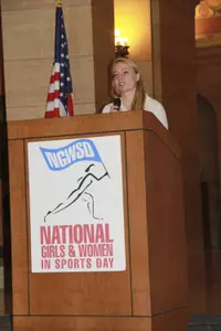 Bethany Brausen represents Minnesota women's hockey as it received the Milestone Award