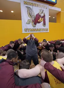 Gophers 2014 men's gymnastics team cheers before a meet