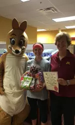 Head coach Wendy Davis and Erica Fealko pose with Wiley Wallaby.