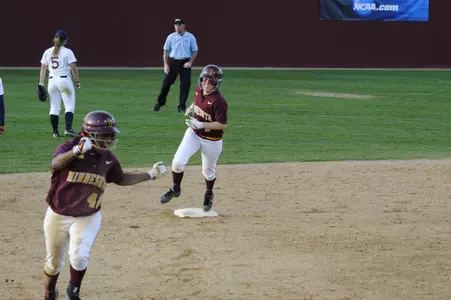Sam Macken and Tyler Walker round the bases after Macken's homer gave the Gophers an 8-6 lead.