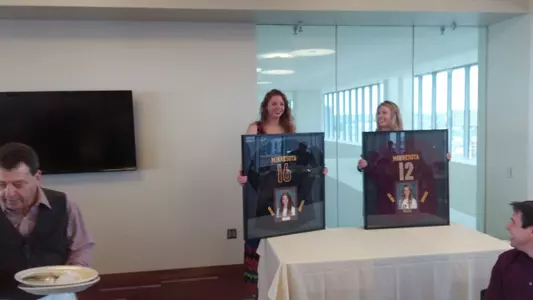 Seniors Adrianna Nora and Morgan Bohl receive their jerseys