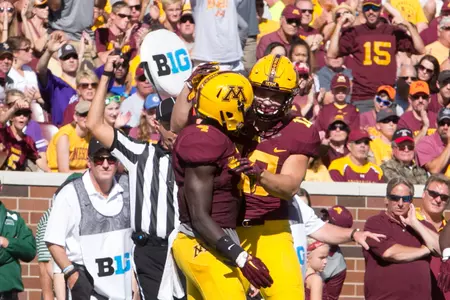 Adekunle Ayinde (left) and Cody Poock have played large roles for the Minnesota defense this season.