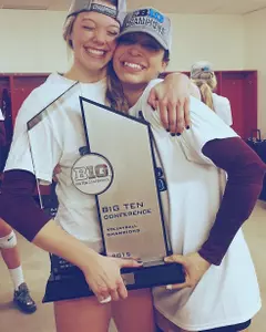 Paige Tapp and Daly Santana holding the Big Ten Champs trophy