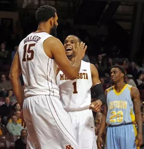 Andre Hollins and Maurice Walke's media and r were honored by the conference's media and head coaches.