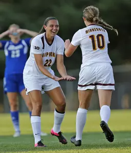 Tori Burnett celebrates with Emily Heslin who tallied the first goal of her collegiate career.