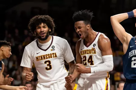 Minnesota Gophers forward Eric Curry (24), Minnesota Gophers forward Jordan Murphy (3)