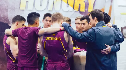 Maroon and Gold Meet huddle