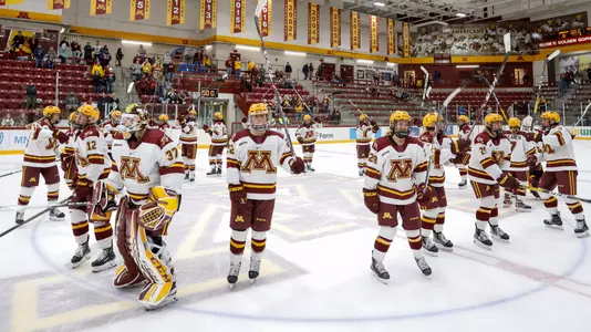 Team salutes the fans.NCAA Hockey: Colgate v Minnesota