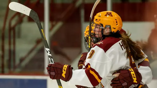 Taylor Heise (9) celebrates her 2nd goalNCAA Hockey: Colgate v Minnesota