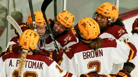 Sarah Potomak (26) celebrates her goal with Taylor Wente (28), Crystalyn Hengler (13)NCAA Hockey: Colgate v Minnesota