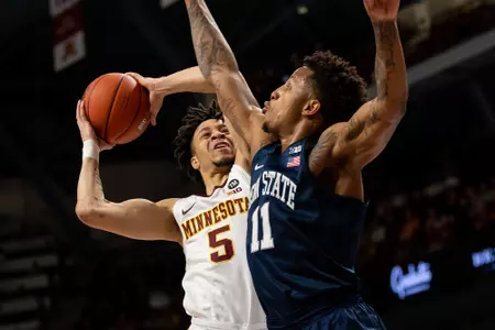 Minnesota Gophers guard Amir Coffey (5)